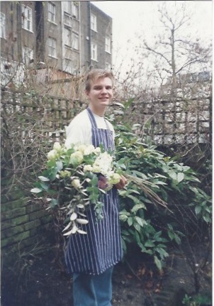 Michael at Jane Packer’s house with a flower arrangement in February 1992